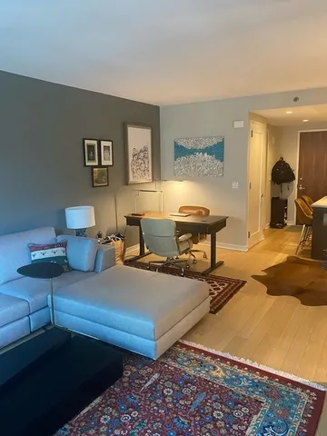 a living room with furniture and a table