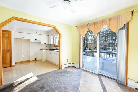 a view of a kitchen with a sink and a window