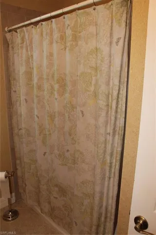 a bathroom with a shower curtain