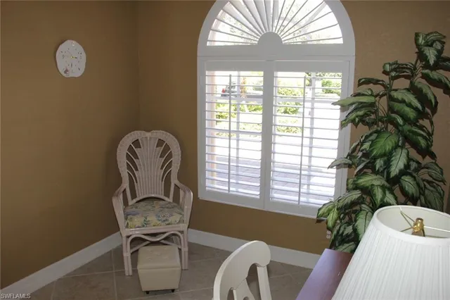 a view of a livingroom with furniture and a window