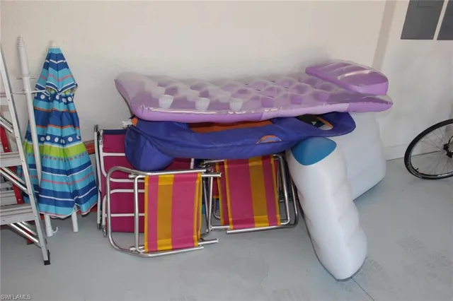 a bed room with a bed and a chandelier