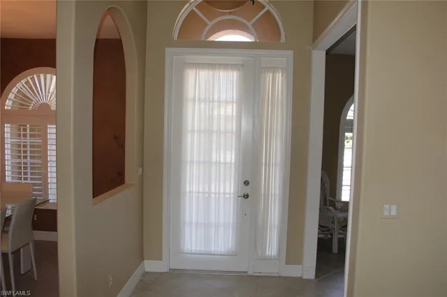 a view of a hallway with windows
