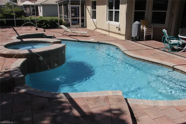 a view of a backyard with sitting area