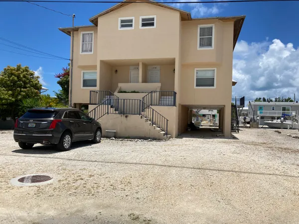 a view of a car parked in front of a house