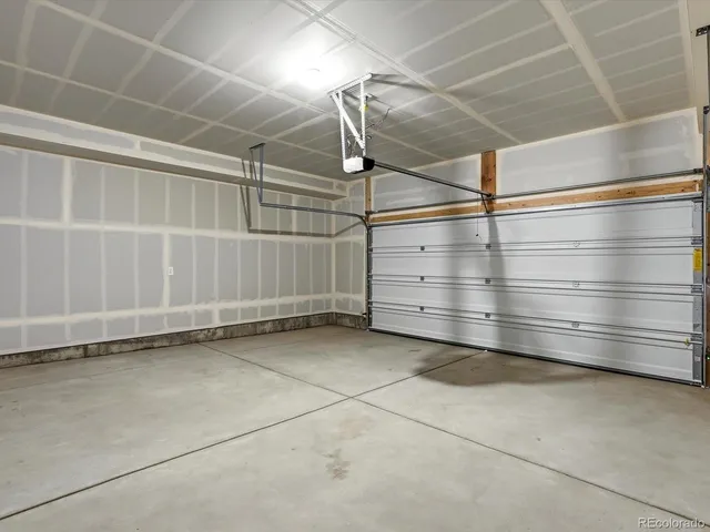 an empty room with closet and a bathroom