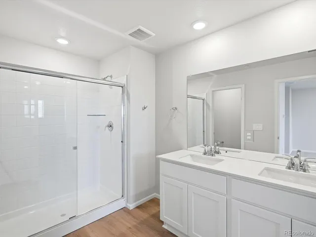 an empty room with closet and a bathroom