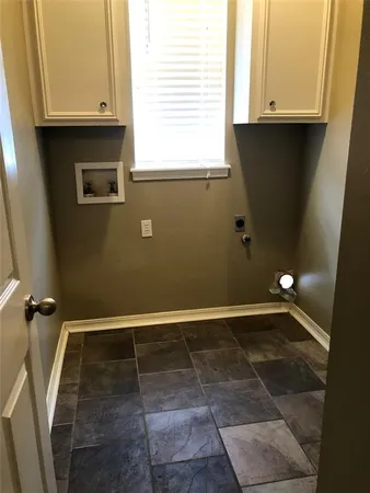 a view of a utility room with a sink
