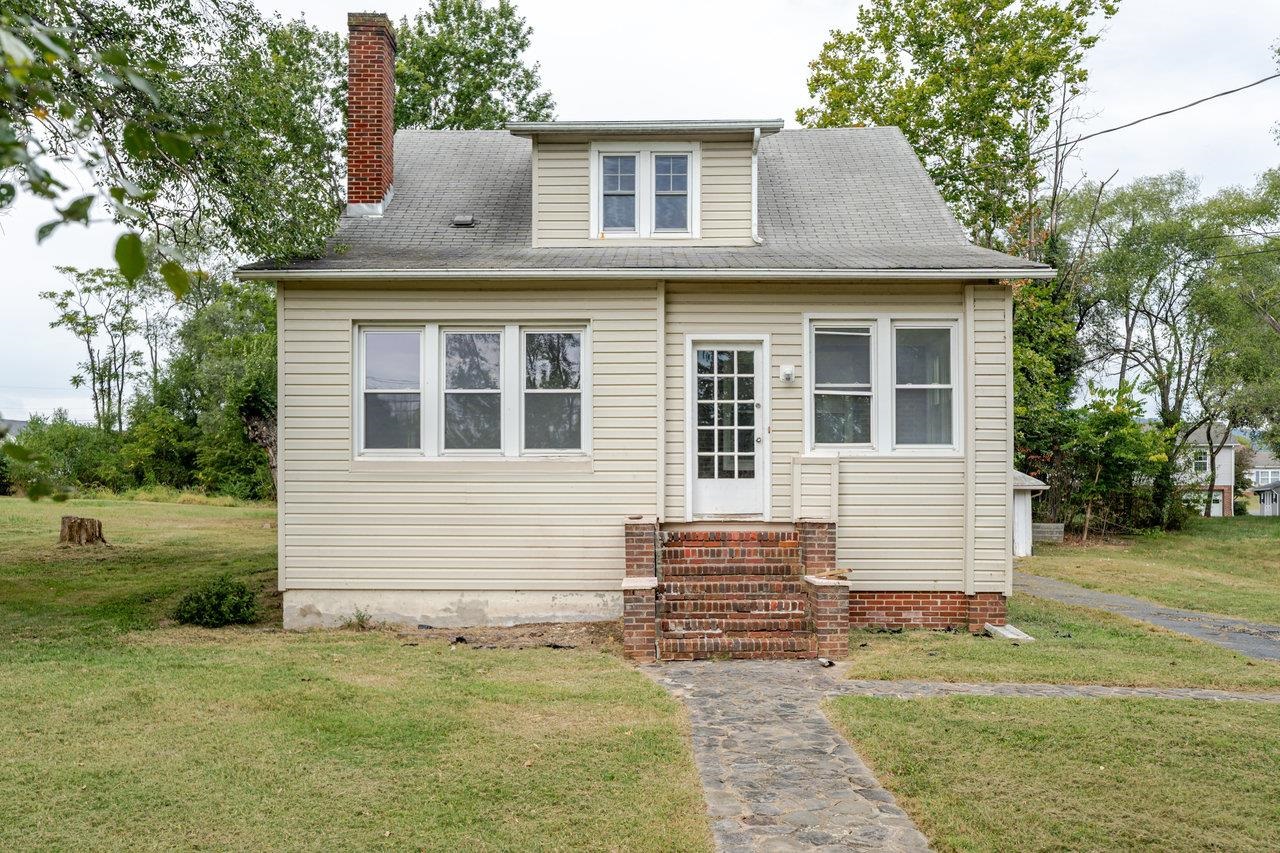9571 Town Hall Road McGaheysville, VA 22840 - Photo 1 of 66 a front view of a house with garden