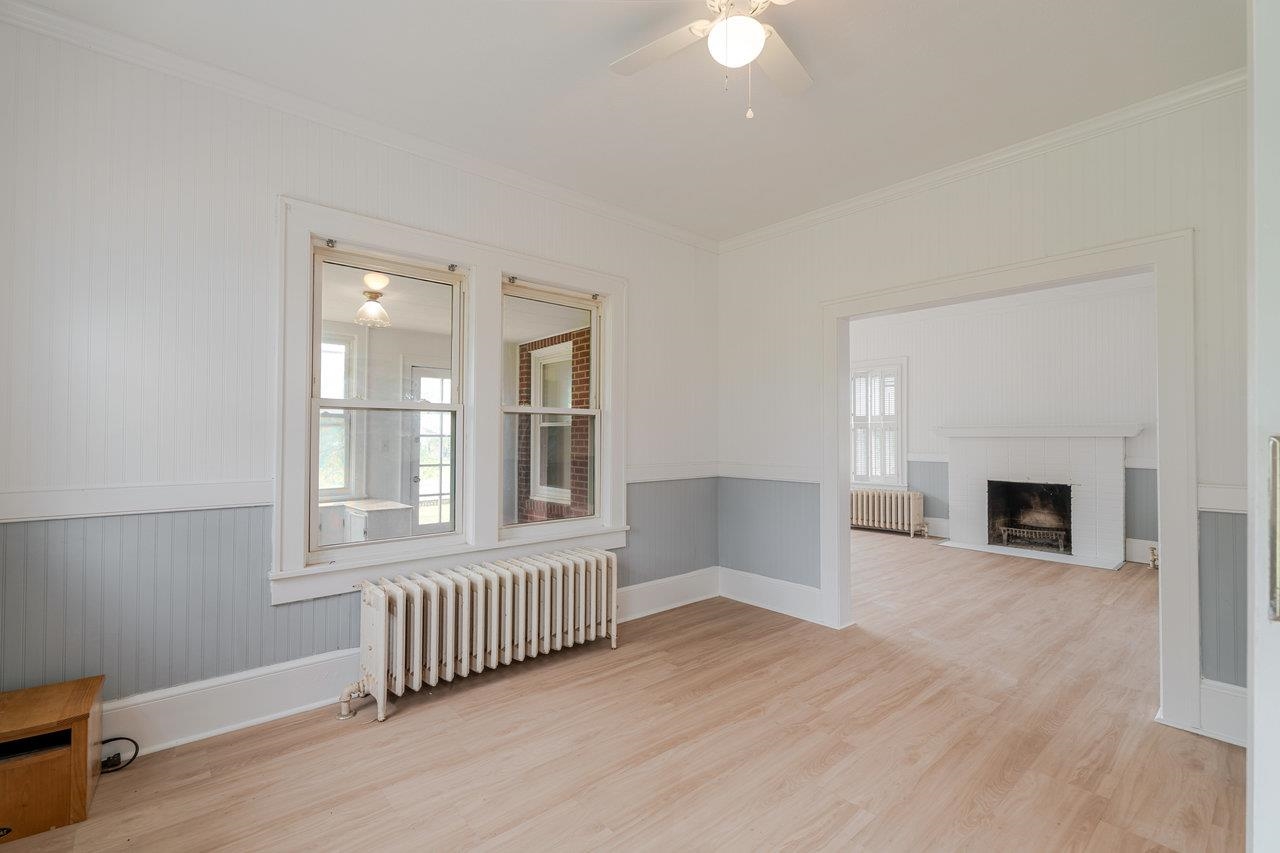 9571 Town Hall Road McGaheysville, VA 22840 - Photo 18 of 66 an empty room with windows and fireplace