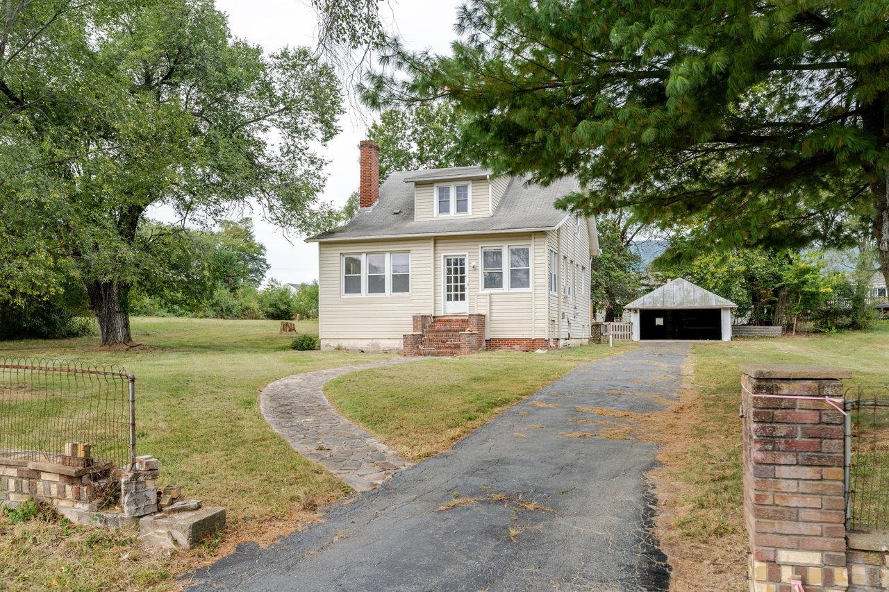9571 Town Hall Road McGaheysville, VA 22840 - Photo 2 of 66 a front view of a house with garden