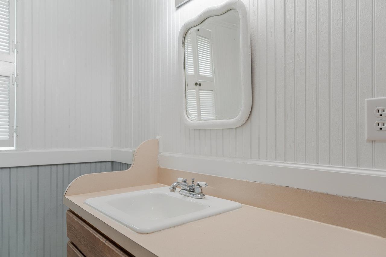 9571 Town Hall Road McGaheysville, VA 22840 - Photo 26 of 66 a bathroom with a sink and a mirror