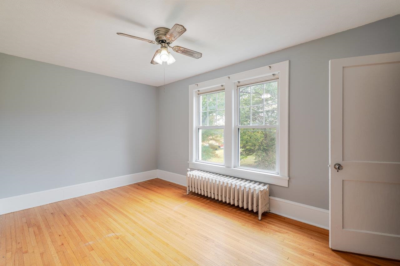 9571 Town Hall Road McGaheysville, VA 22840 - Photo 32 of 66 a view of an empty room with a window and wooden floor
