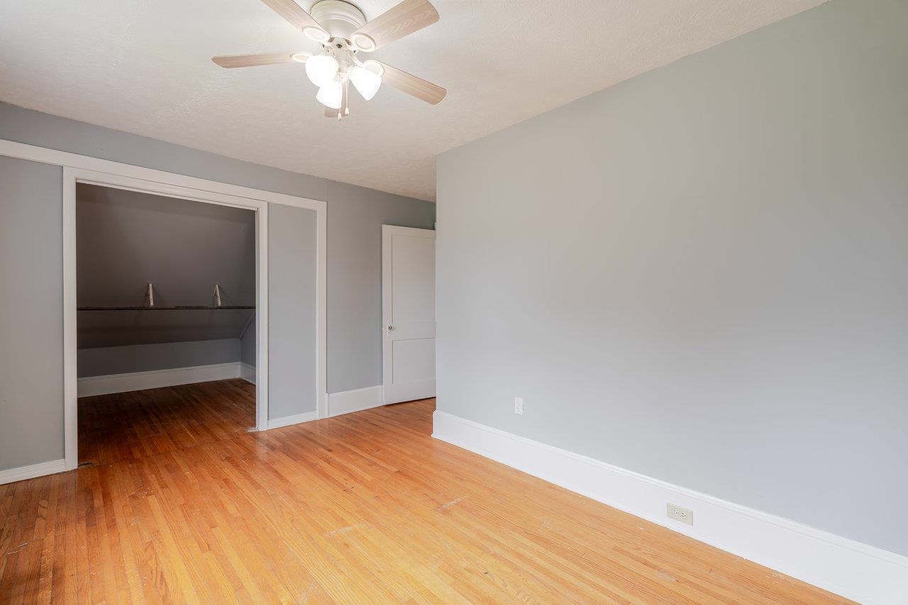 9571 Town Hall Road McGaheysville, VA 22840 - Photo 37 of 66 a view of a room with wooden floor and a ceiling fan