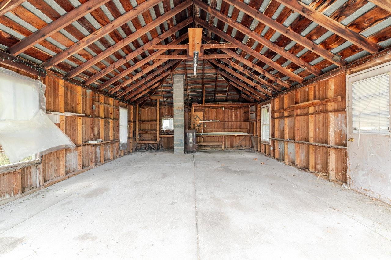 9571 Town Hall Road McGaheysville, VA 22840 - Photo 49 of 66 a view of an empty room with wooden ceiling