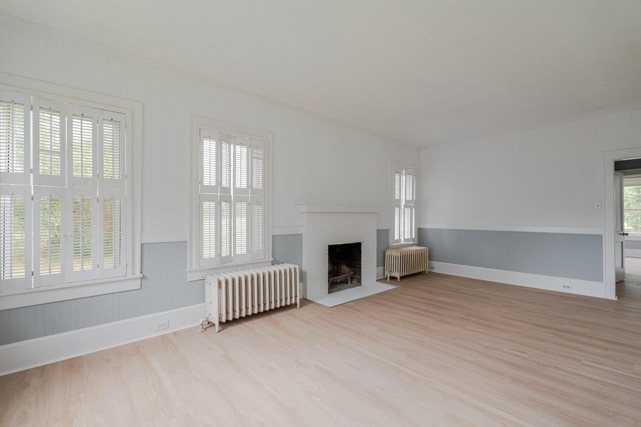 9571 Town Hall Road McGaheysville, VA 22840 - Photo 9 of 66 wooden floor fireplace and windows in an empty room