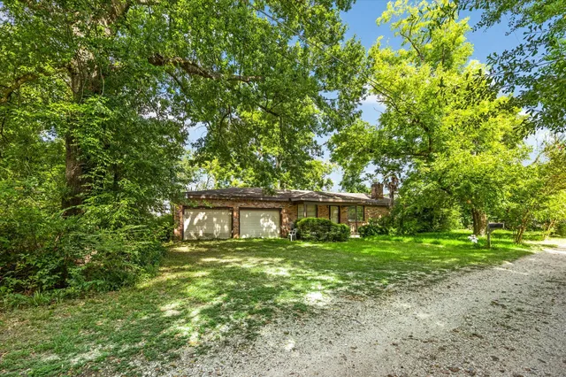 a house view with a garden space