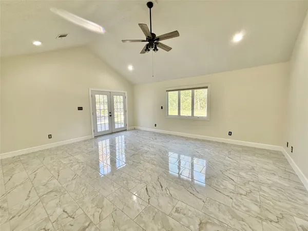 a bathroom with a tub shower and a sink