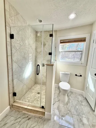 a bath tub sitting in a bathroom next to a sink