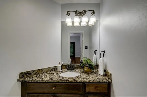 a kitchen with stainless steel appliances a stove a sink and a microwave