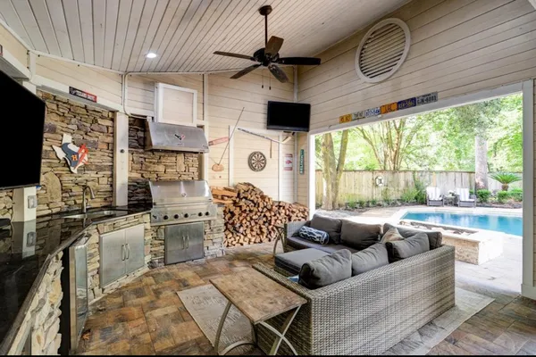a view of a house with pool and a yard