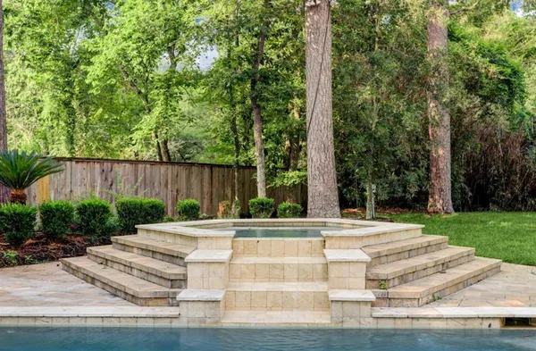 a view of a patio with swimming pool