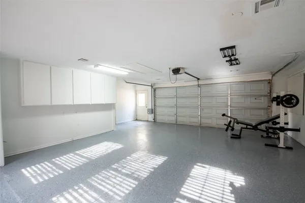 a view of a room with gym equipment and a large window