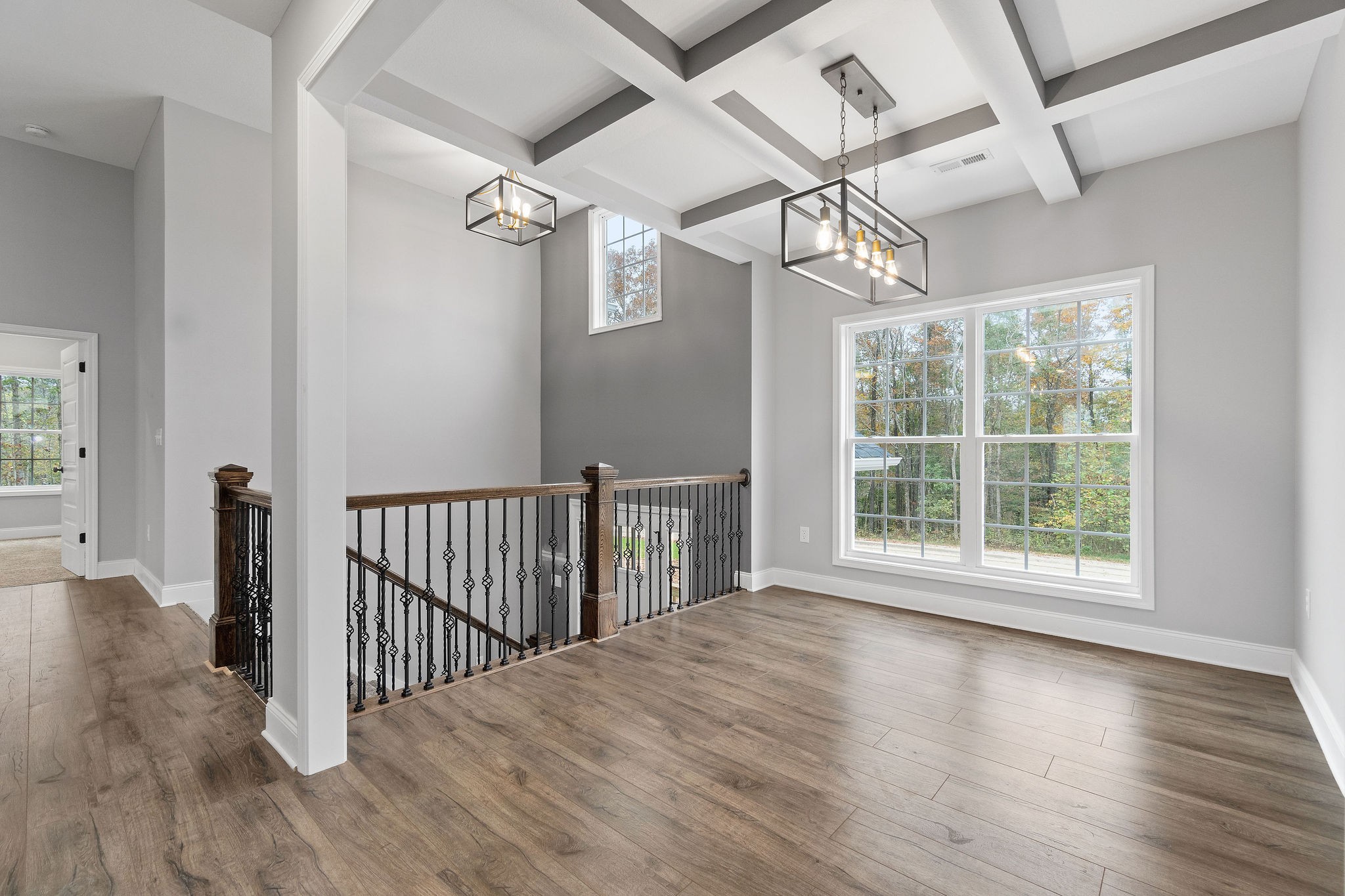 2790 Russell Road Palmyra, TN 37142 - Photo 13 of 31 an empty room with wooden floor fan and windows