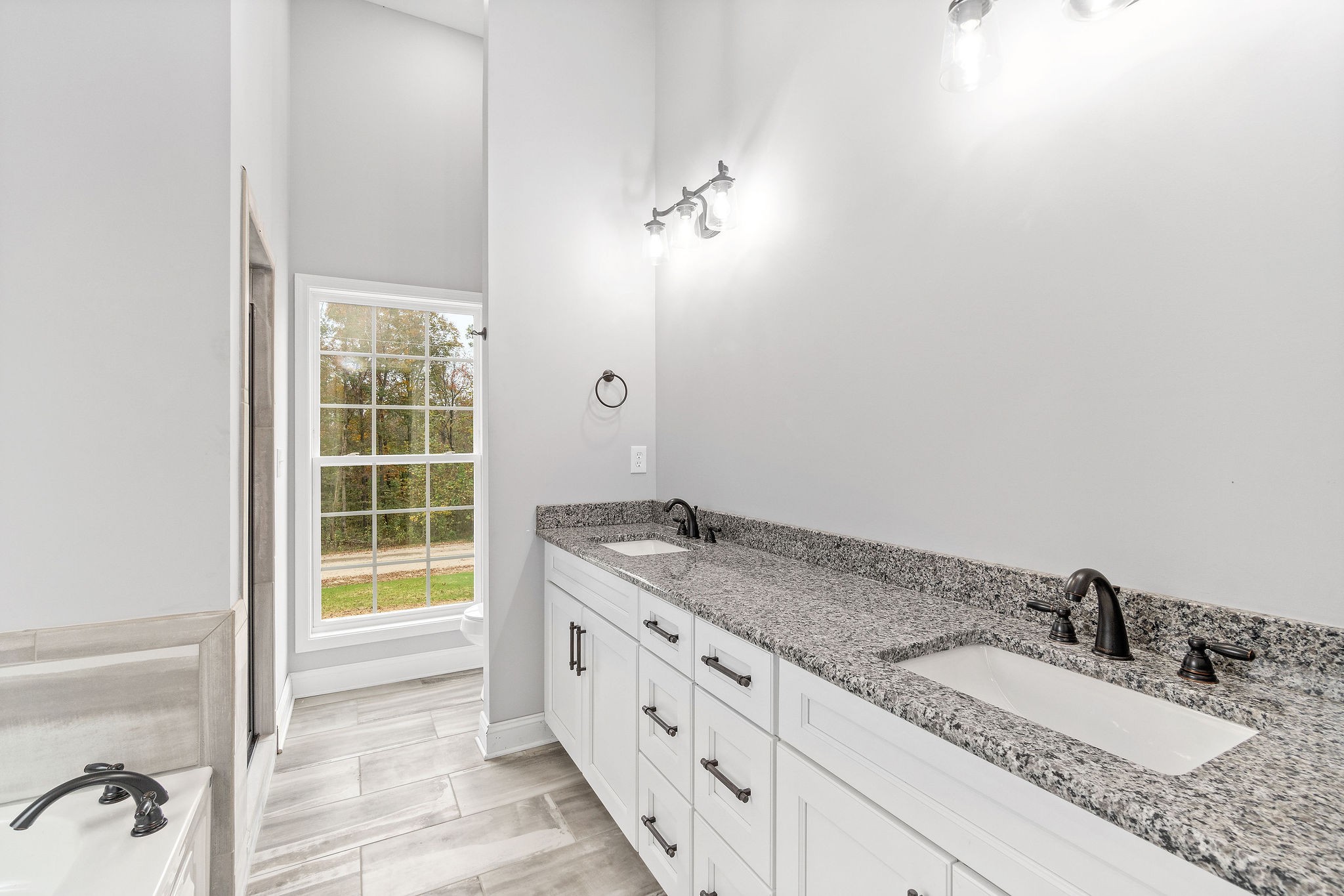 2790 Russell Road Palmyra, TN 37142 - Photo 16 of 31 a bathroom with a granite countertop sink and a mirror