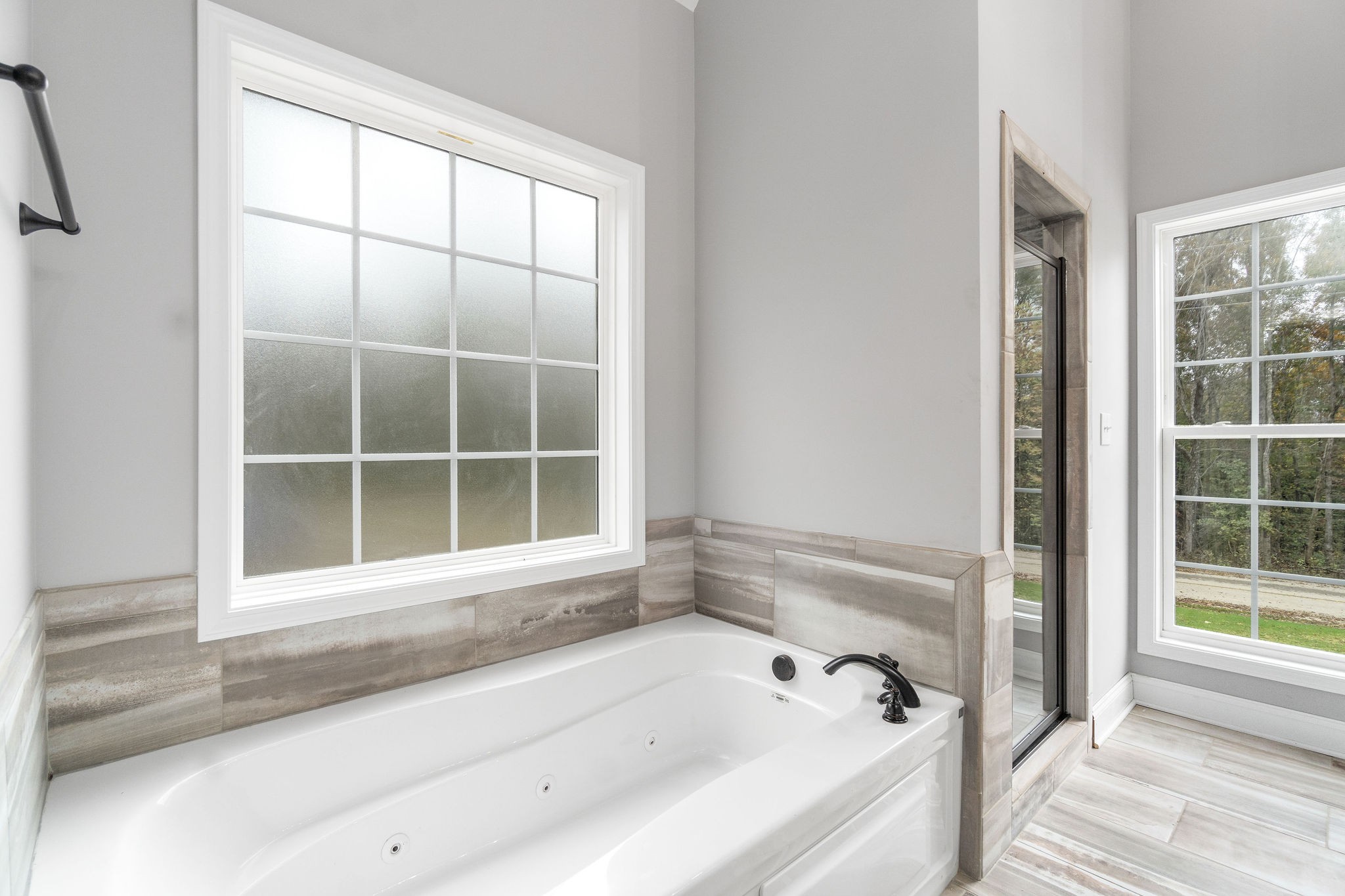 2790 Russell Road Palmyra, TN 37142 - Photo 17 of 31 a bathroom with a bathtub and a shower