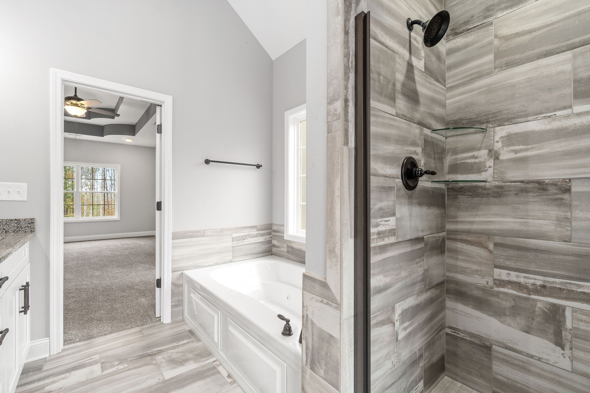 2790 Russell Road Palmyra, TN 37142 - Photo 18 of 31 a bathroom with a tub shower and sink