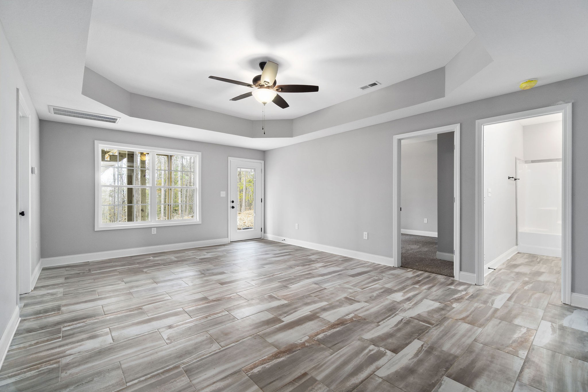 2790 Russell Road Palmyra, TN 37142 - Photo 22 of 31 a view of an empty room with a window and wooden floor