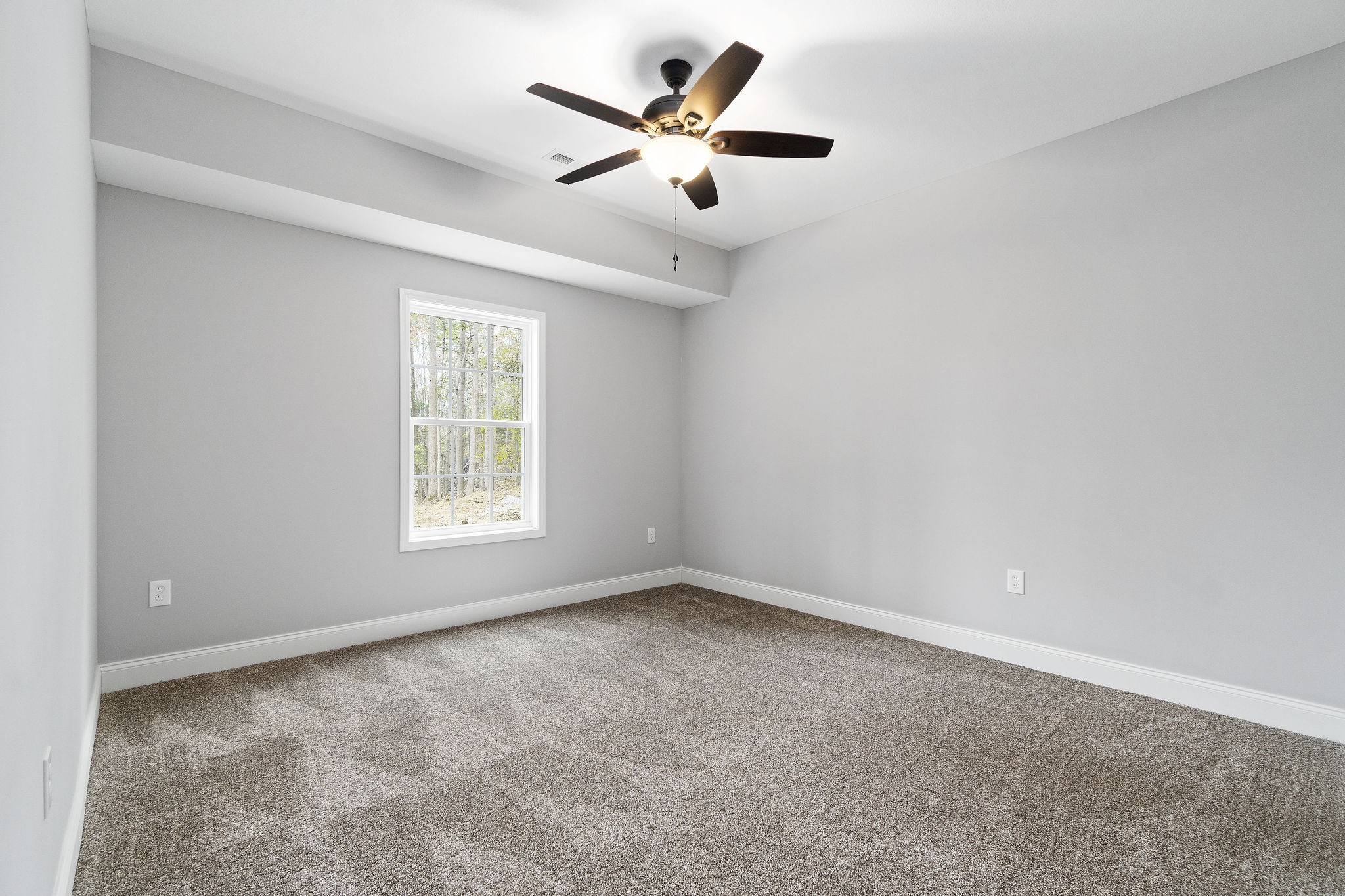 2790 Russell Road Palmyra, TN 37142 - Photo 24 of 31 an empty room with ceiling fan and windows