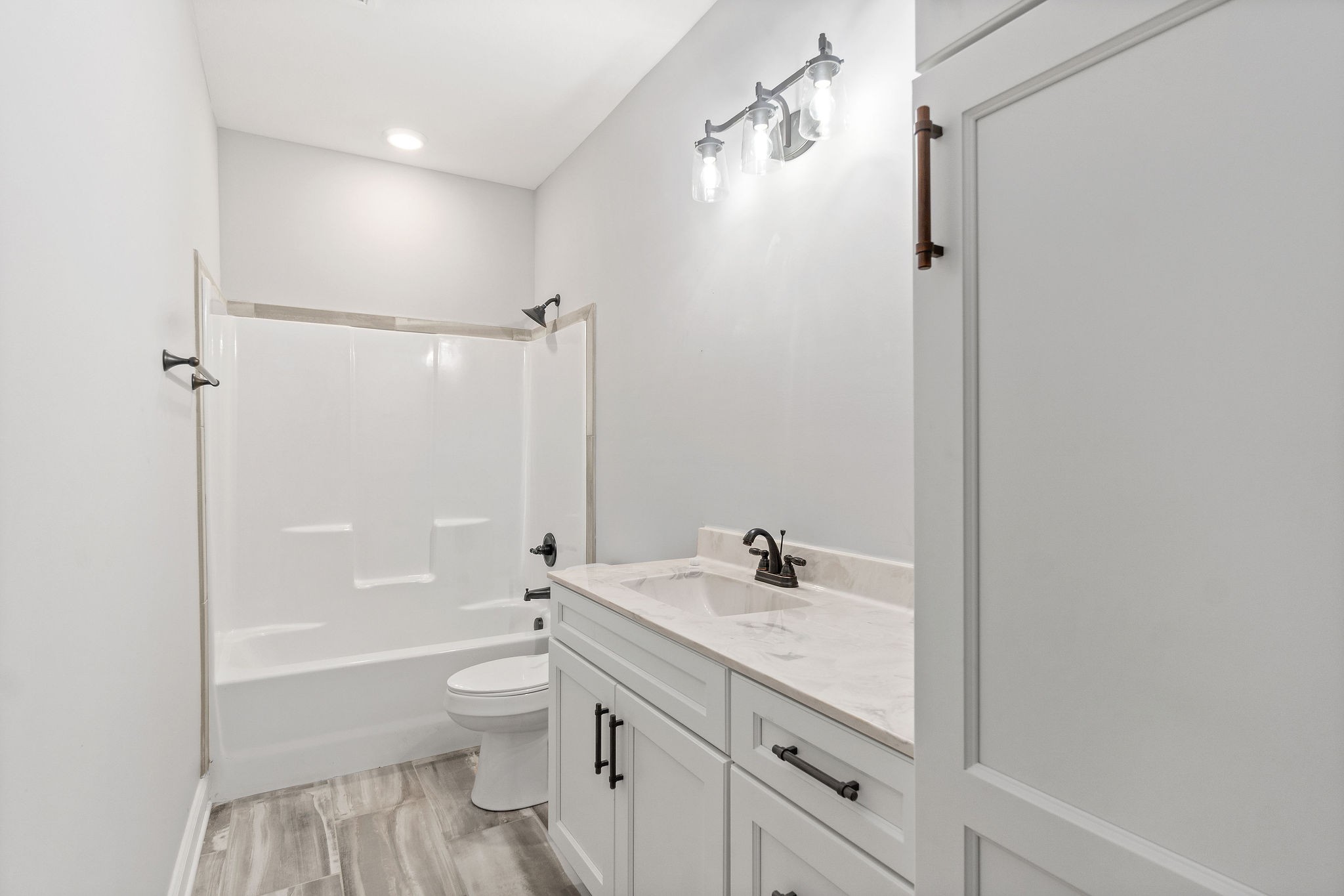 2790 Russell Road Palmyra, TN 37142 - Photo 25 of 31 a bathroom with a sink a toilet and shower
