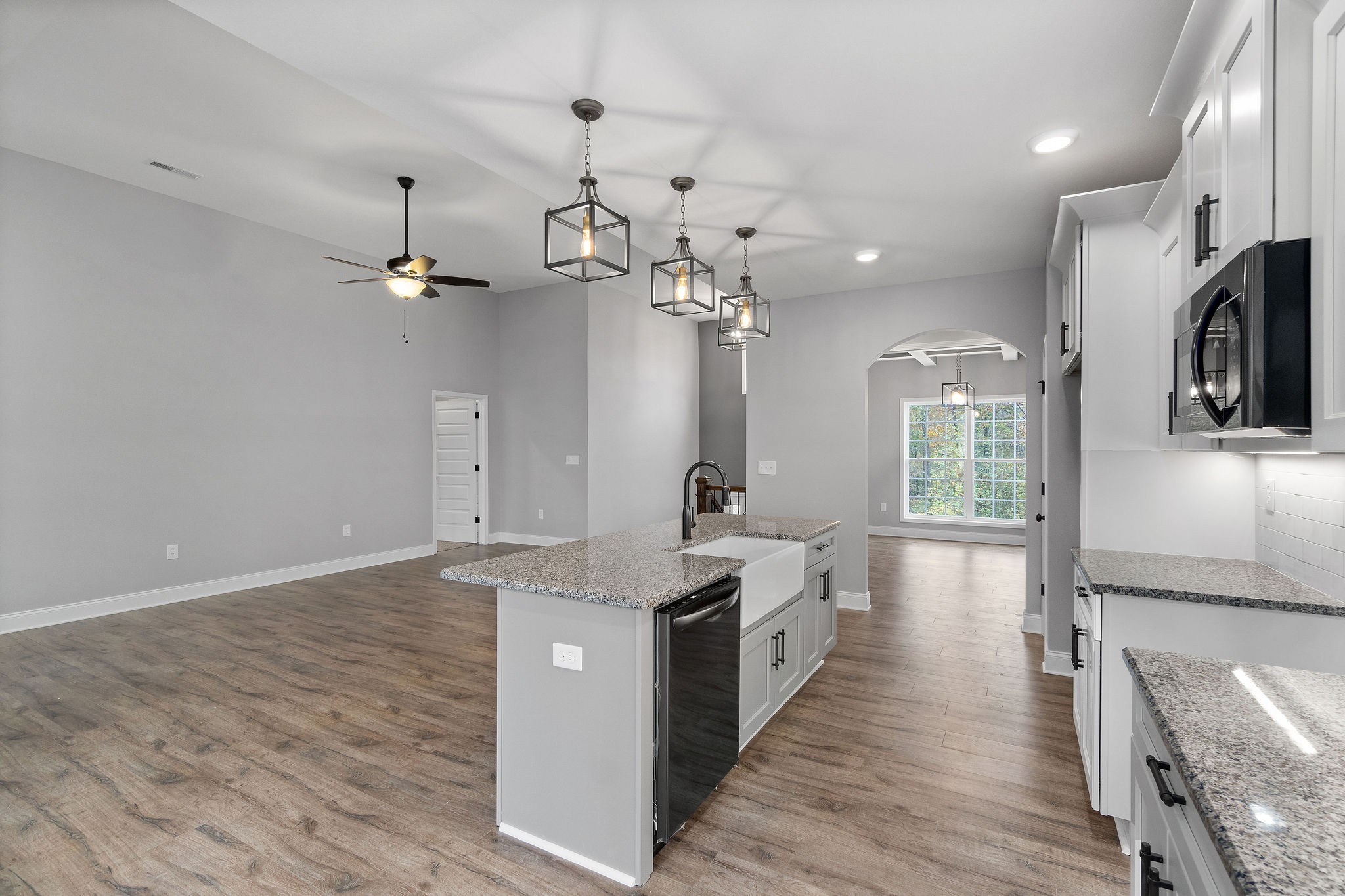 2790 Russell Road Palmyra, TN 37142 - Photo 10 of 31 a large kitchen with stainless steel appliances a lot of counter space and wooden floor
