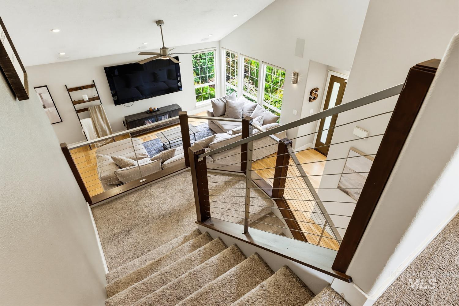 369 South Winthrop Way Boise, ID 83709 - Photo 25 of 50 Upper-level landing with carpeted stairs, modern cable railing, and wood-finish posts