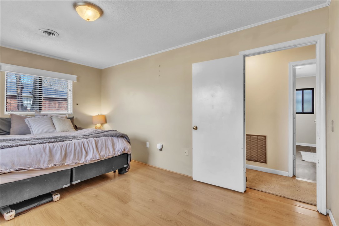 139 Louise Drive Pendleton, SC 29670 - Photo 13 of 26 This spacious bedroom features warm wood flooring and a view of the outdoors.