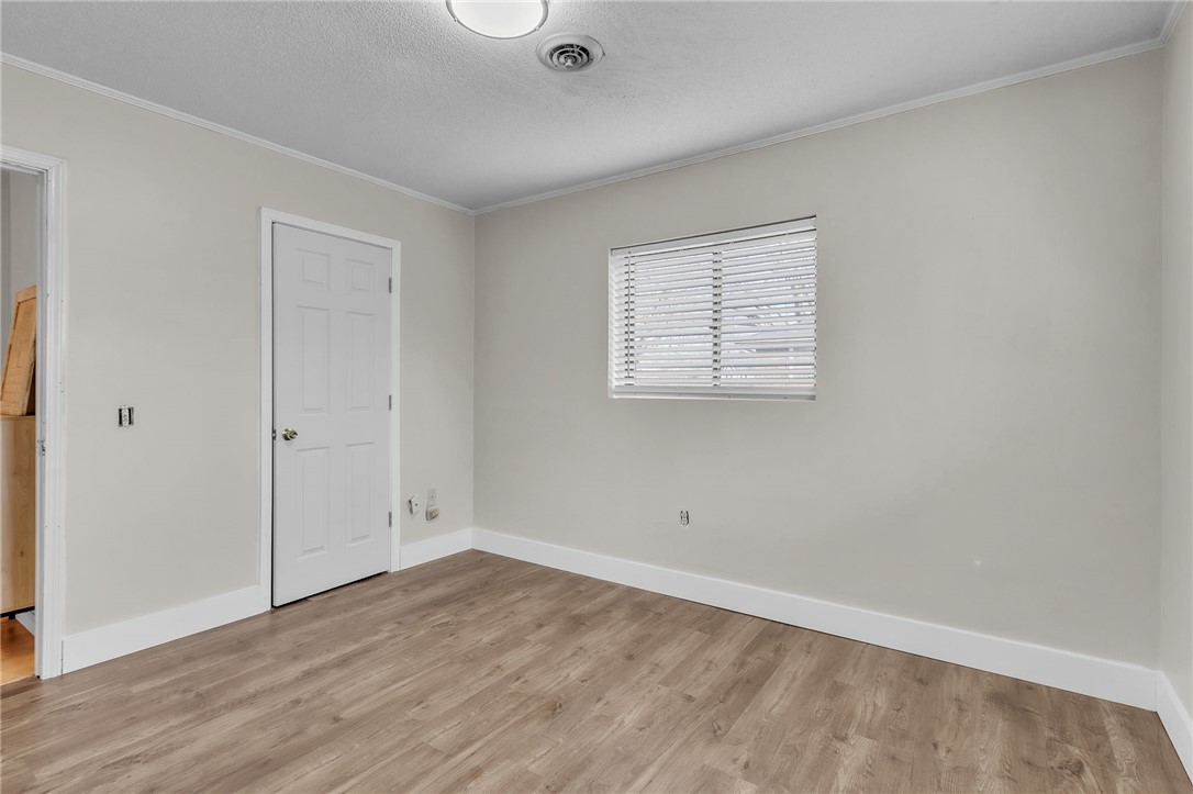 139 Louise Drive Pendleton, SC 29670 - Photo 19 of 26 This bright bedroom features durable flooring and a window with natural light.