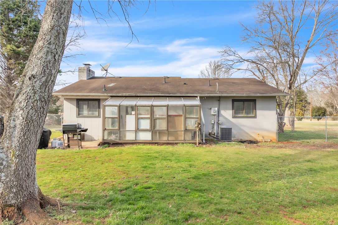 139 Louise Drive Pendleton, SC 29670 - Photo 24 of 26 This cozy home offers a private yard with ample outdoor space and a charming sunroom.