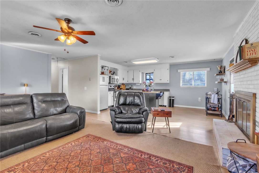 139 Louise Drive Pendleton, SC 29670 - Photo 5 of 26 This inviting space combines a cozy living area with an open-concept kitchen.