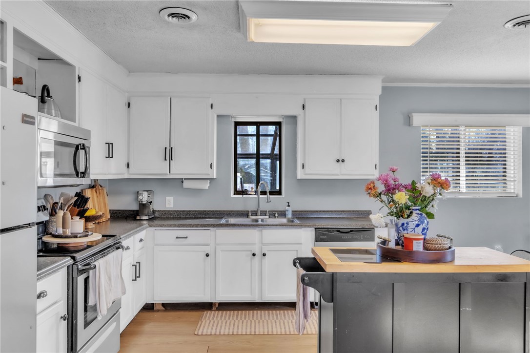 139 Louise Drive Pendleton, SC 29670 - Photo 8 of 26 This bright kitchen offers a practical layout with ample cabinetry and essential appliances.
