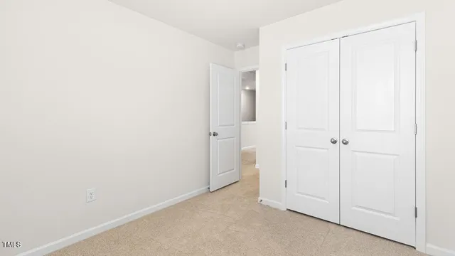 a view of a closet and utility room