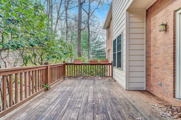 a view of a balcony with wooden floor