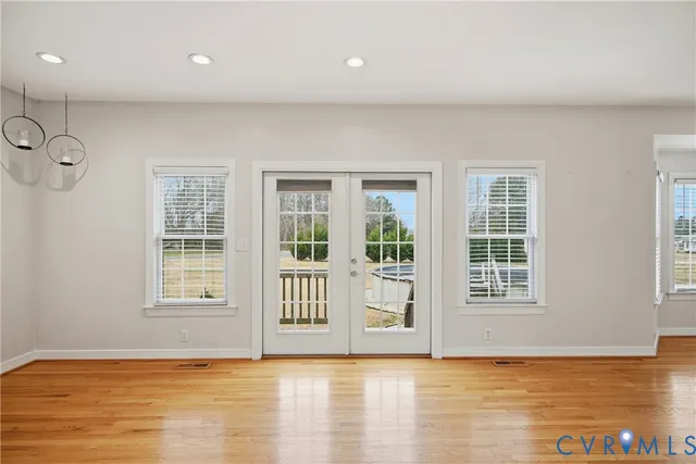 a bathroom with a granite countertop toilet and a shower