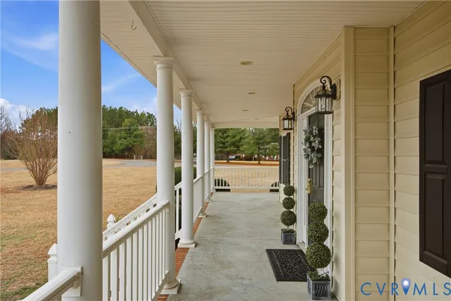 a view of an entryway with wooden floor and door