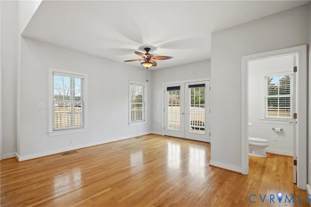 a kitchen with a refrigerator sink and cabinets