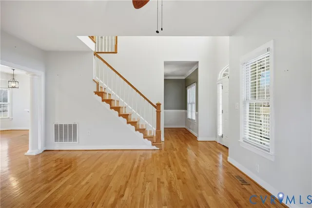 a kitchen with stainless steel appliances granite countertop white cabinets and a stove