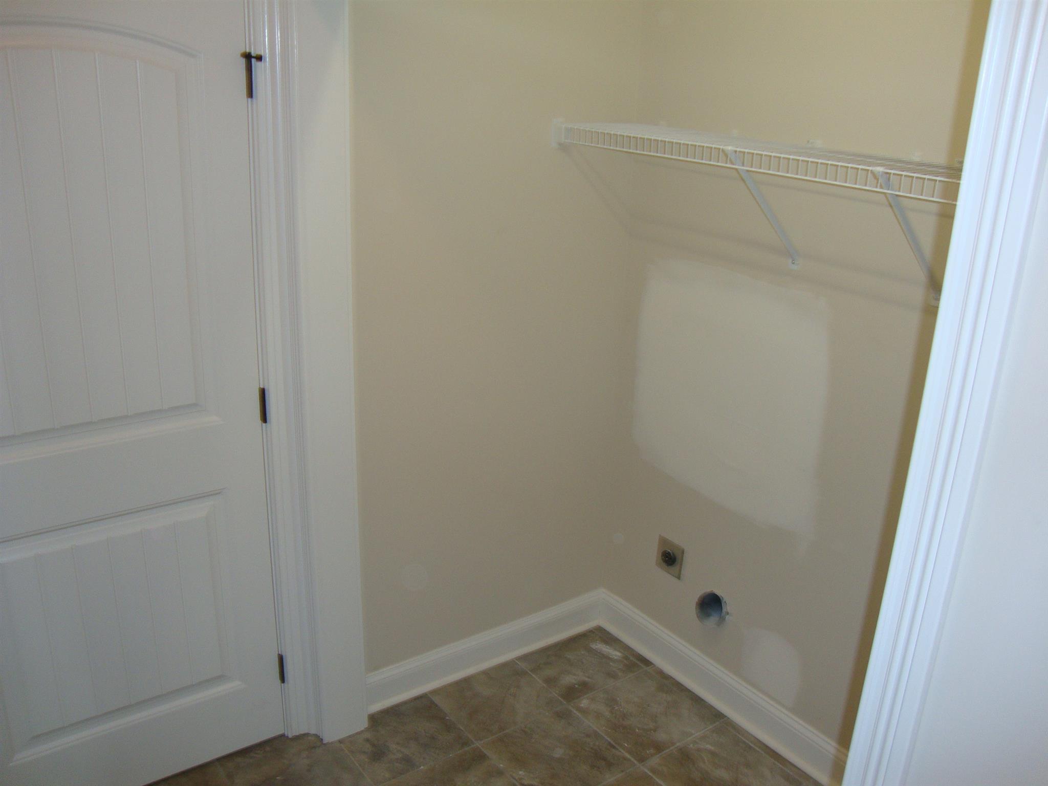 3596 Drake Road Adams, TN 37010 - Photo 16 of 25 a bathroom with a glass shower door