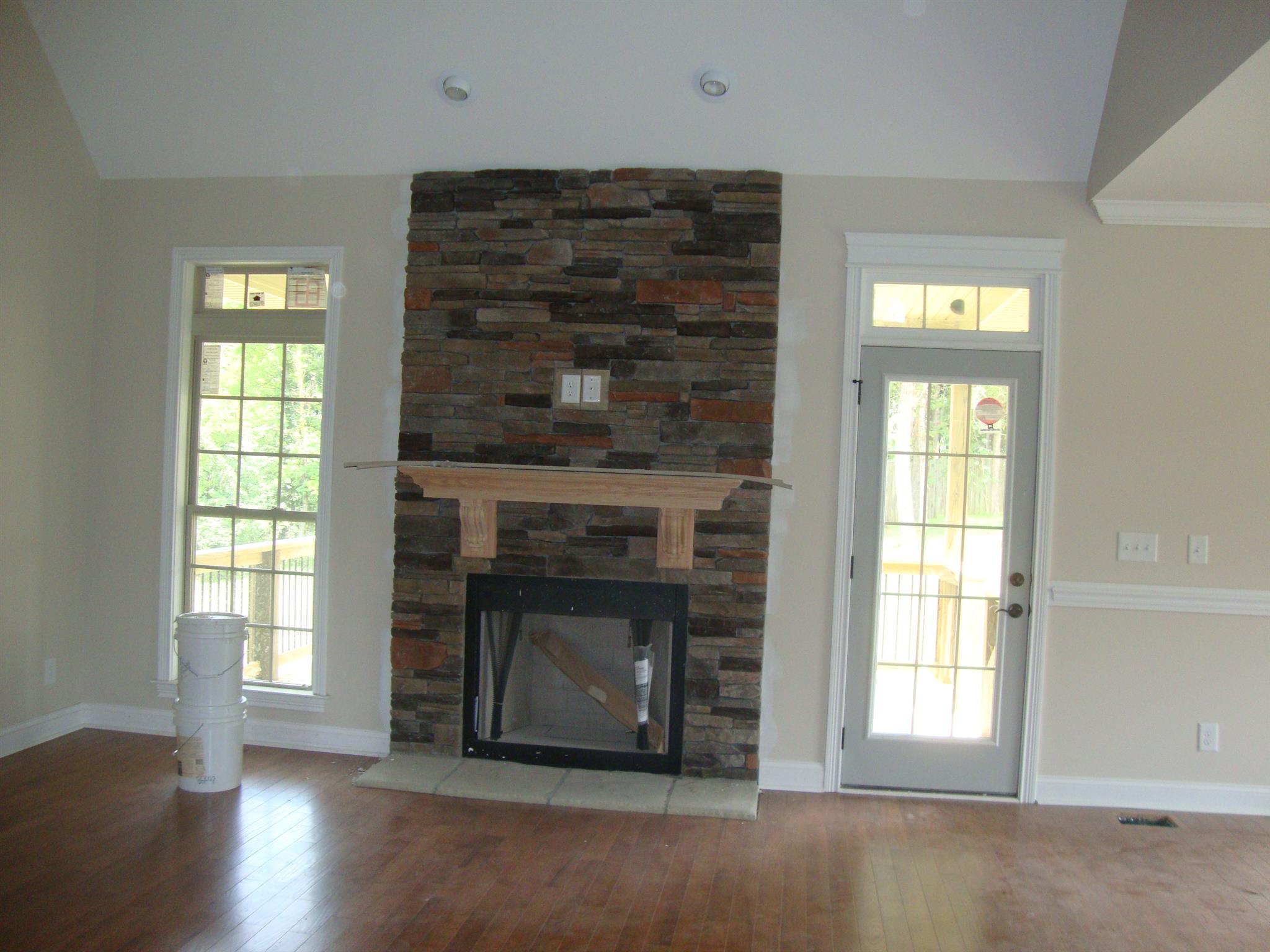 3596 Drake Road Adams, TN 37010 - Photo 23 of 25 a living room with a fireplace and a window