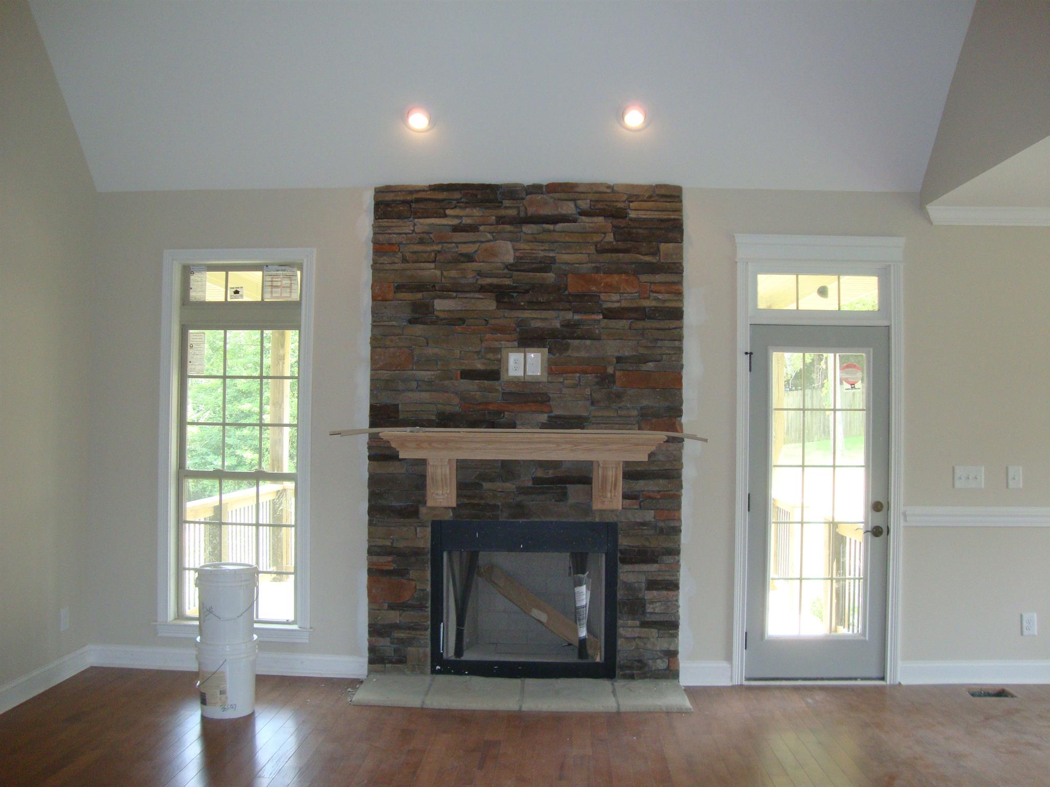 3596 Drake Road Adams, TN 37010 - Photo 6 of 25 a living room with a fireplace and wooden floor
