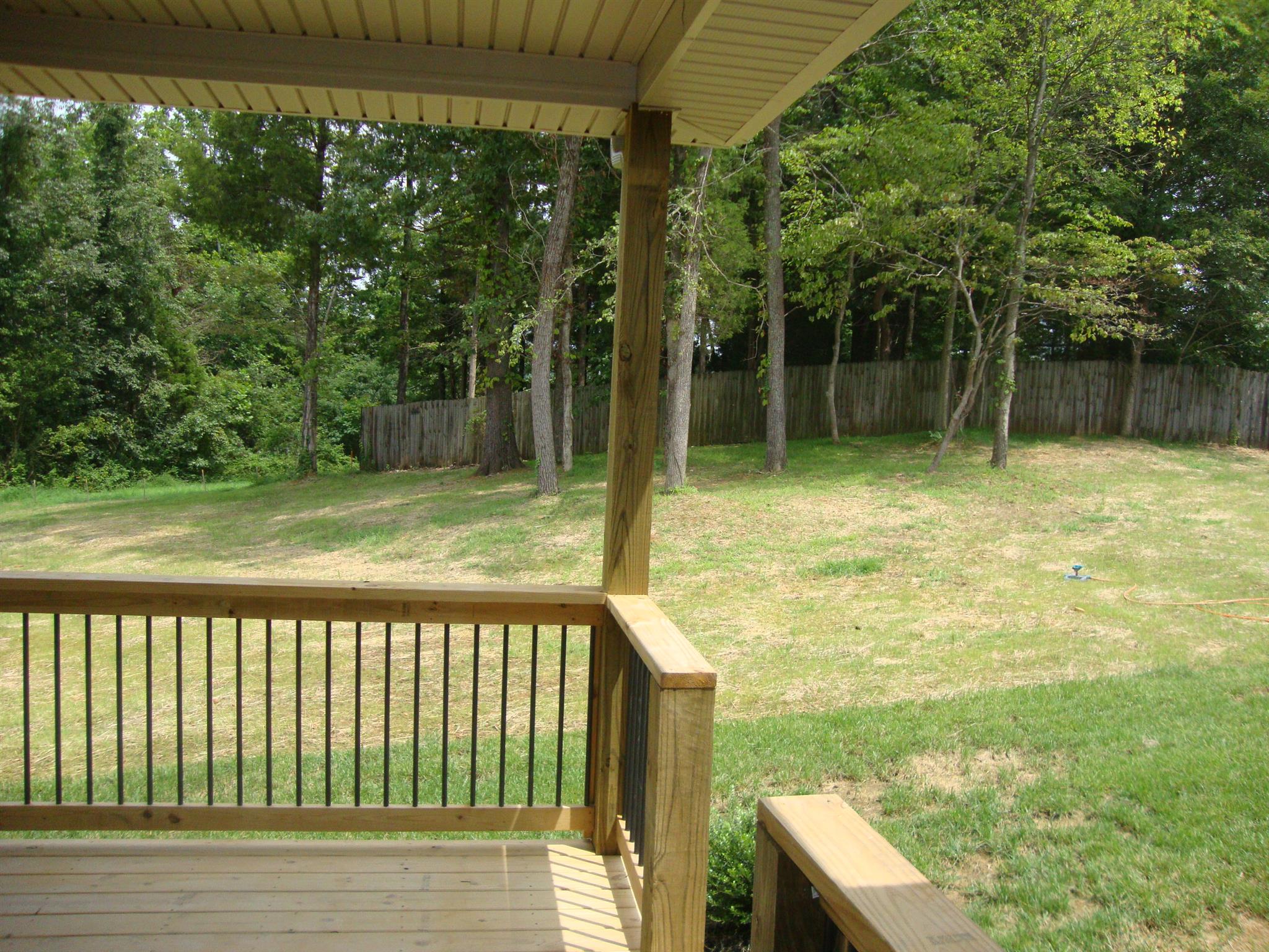 3596 Drake Road Adams, TN 37010 - Photo 7 of 25 a view of a balcony with a yard